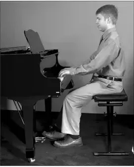Photo: correct seated posture at the keyboard with forearms parallel to the floor